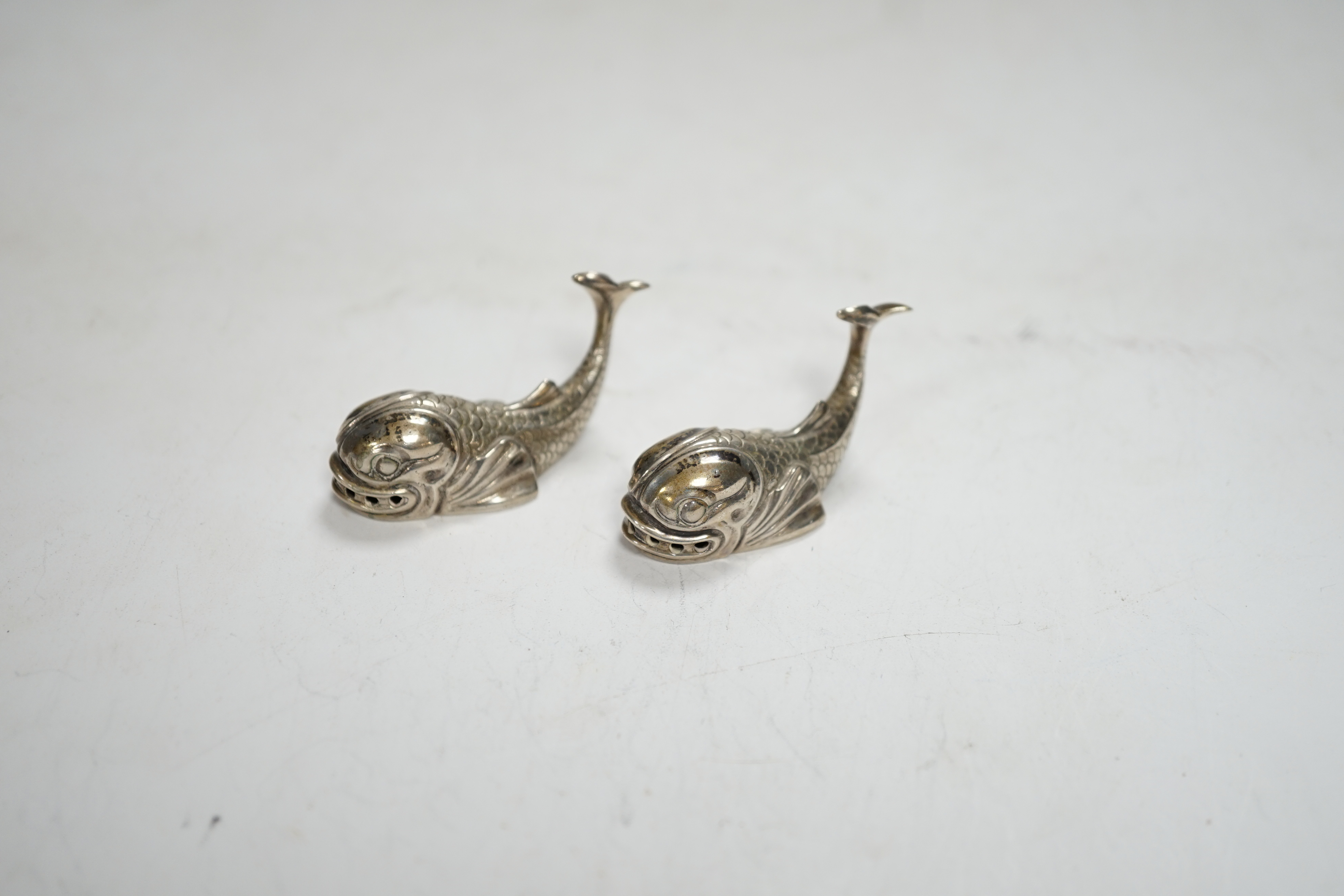 A pair of 20th century Italian Missiaglia 800 standard white metal novelty pepperettes, modelled as fish, length 42mm.